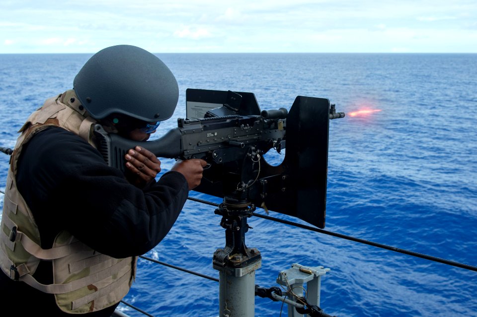 USS Anchorage (LPD-23) sailor firing M240 machine gun during weapons training 140412-N-KL846-078