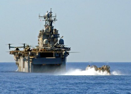 US Navy 100125-N-1082Z-018 he multi-purpose amphibious assault ship USS Nassau (LHA 4) receives a landing craft air cushion (LCAC)