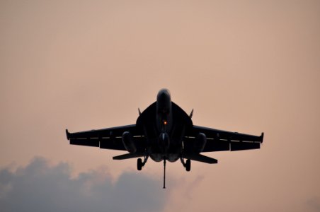 US Navy 100125-N-8421M-027 An F-A-18E Super Hornet assigned to the Tophatters of Strike Fighter Squadron (VFA) 14 prepares to land aboard the aircraft carrier USS Nimitz (CVN 68)