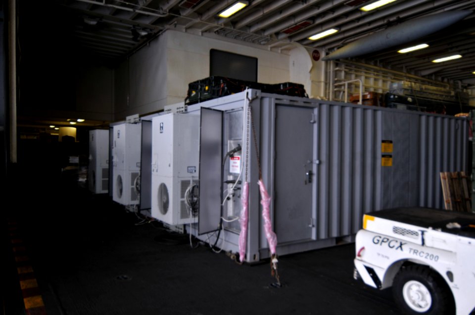 US Navy 100126-N-1831S-011 A media trailer is operational in the hangar bay of the multi-purpose amphibious assault ship USS Bataan (LHD 5)