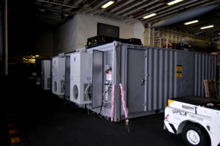 US Navy 100126-N-1831S-011 A media trailer is operational in the hangar bay of the multi-purpose amphibious assault ship USS Bataan (LHD 5)