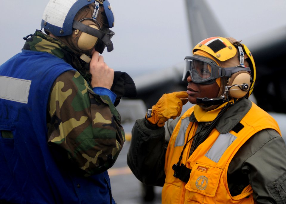 US Navy 100125-N-5215E-012 PHILIPPINE SEA (Jan. 25, 2010) Chief Warrant Officer LaTonya Wallace, right, speaks with Aviation Boatswain's Mate (handling) Airman Recruit Ryan Elkins