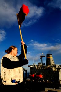 US Navy 100126-N-9928E-016 Quartermaster Seaman Britney Benigno, from Wichita Falls, Texas, signals the bridge of the Nimitz-class aircraft carrier USS John C. Stennis (CVN 74)