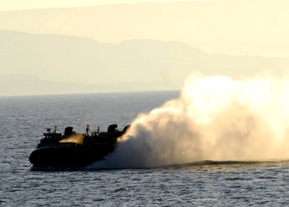 US Navy 100125-N-5148B-055 A landing craft air cushion prepares to enter USS Bonhomme Richard photo