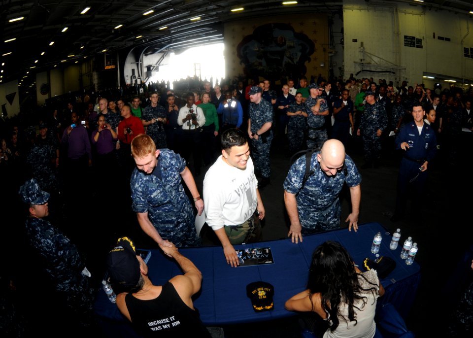 US Navy 100127-N-4236E-294 Actors Stephen Lang and Michelle Rodriguez sign autographs for Sailors aboard the Nimitz-class aircraft carrier USS Dwight D. Eisenhower (CVN 69)
