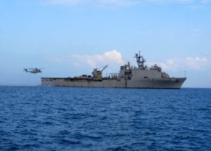 US Navy 100126-N-2000D-018 An MH-53E Sea Dragon helicopter lands on the flight deck of USS Carter Hall (LSD 50)