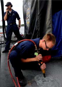 US Navy 100127-N-3560G-001 Sailor performs maintenance aboard USS Louisville