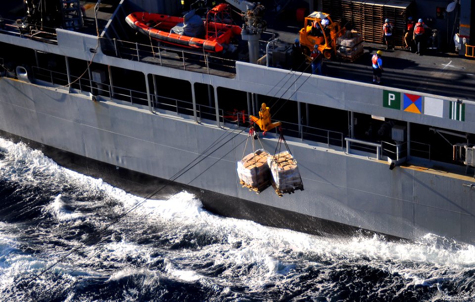 US Navy 100127-N-4774B-033 Pallets of supplies are transported from the fleet replenishment oiler USNS Big Horn (T-AO 198) to the Nimitz-class aircraft carrier USS Carl Vinson (CVN 70)