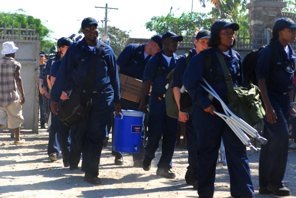 US Navy 100128-N-1092P-071 Sailors enter Lifeline Christian Ministries Mission to clear rubble from fallen buildings and supply crutches to injured Haitians