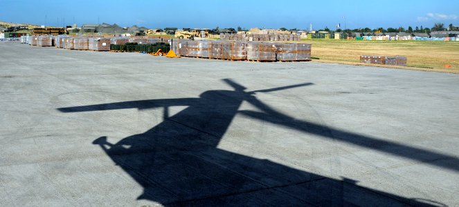 US Navy 100127-N-5214S-176 allets of relief supplies are on the tarmac at Aerodome de Jacmel, an airport in Port-au-Prince, Haiti