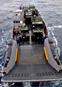 US Navy 100125-N-9950J-083 A landing craft utility vehicle assigned to Assault Craft Unit (ACU) 1 approaches the well deck of the forward-deployed amphibious assault ship USS Essex (LHD 2)