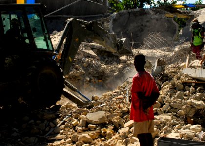 US Navy 100128-N-5244H-100 a Seabee removes rubble from a collapsed church in Baie De Grand Grove, Haiti