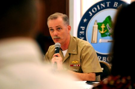 US Navy 100126-N-7498L-105 Capt. Rick Kitchens, commanding officer of Naval Station Pearl Harbor, answers a question during the Joint Base Pearl Harbor-Hickam open house