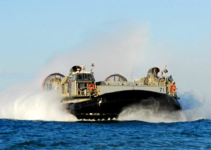 US Navy 100128-N-1092P-438 landing craft air cushion approaches the shores of Grand Goave to pick up and transport Sailors to USS Bataan (LHD 5)