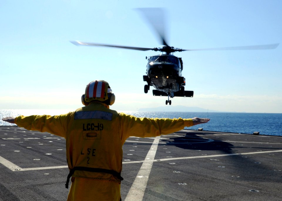 US Navy 100126-N-7478G-167 Seaman Drew Iverson launches an SH-60F Sea Hawk helicopter aboard the U.S. 7th Fleet command ship USS Blue Ridge (LCC 19)