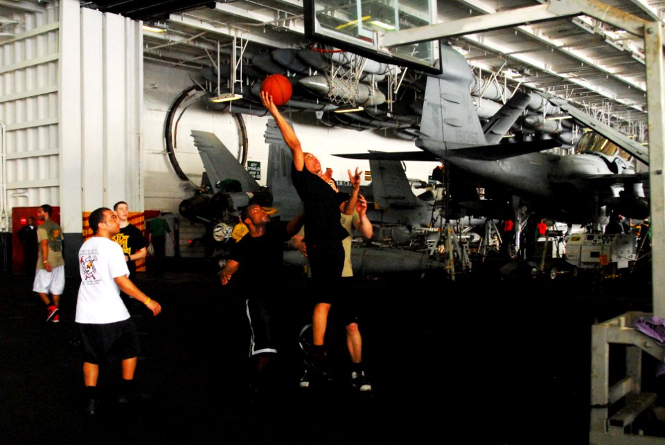 US Navy 100126-N-3327M-047 Sailors enjoy a game of basketball aboard the aircraft carrier USS Nimitz (CVN 68)