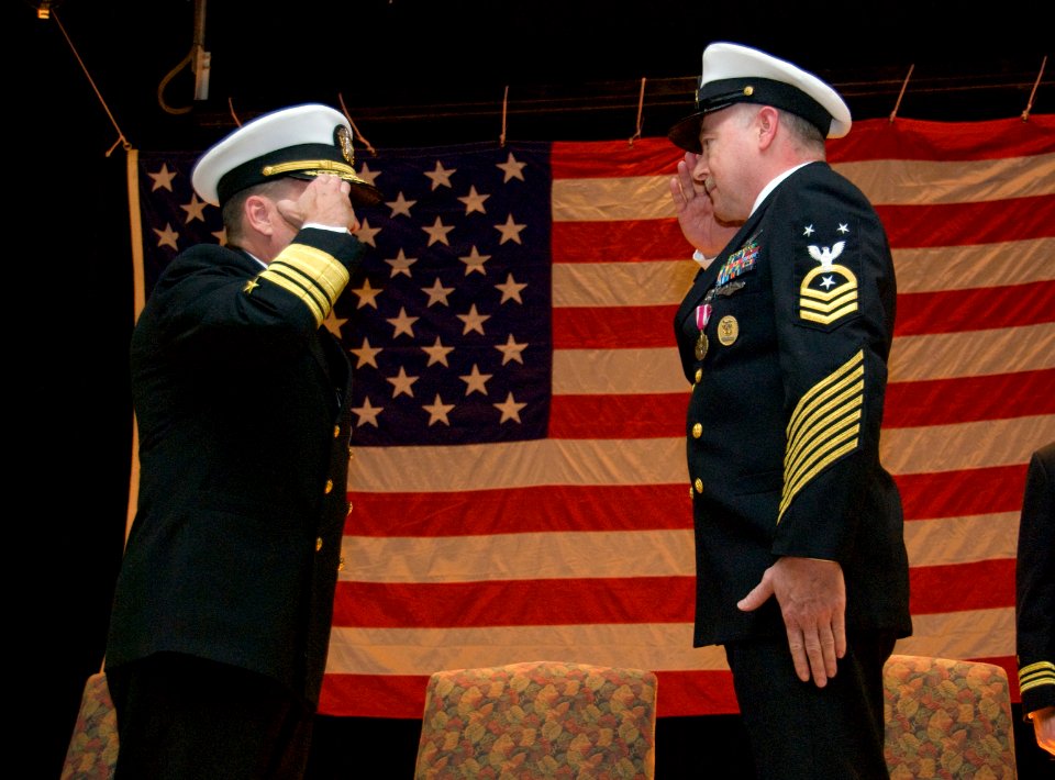 US Navy 100126-N-8053S-082 Master Chief Scott Weaver, right, command master chief, U.S.Naval Forces Central Command, salutes Vice Adm. Bill Gortney, commander, USNAVCENT at his retirement ceremony at Naval Support Activity Bahr