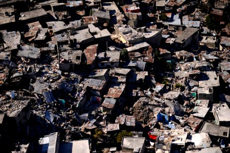 US Navy 100128-N-5345W-268 A neighborhood is in ruins in the Haitian capital of Port-au-Prince following the devastating 7.0 magnitude earthquake that struck the region on Jan. 12, 2010