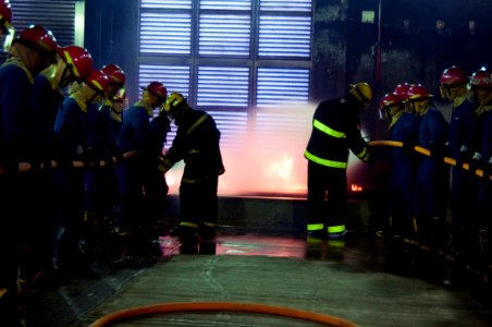 US Navy 100128-N-1251W-002 Instructors show Sailors assigned to the aircraft carrier USS George Washington (CVN 73) proper fire hose handling techniques
