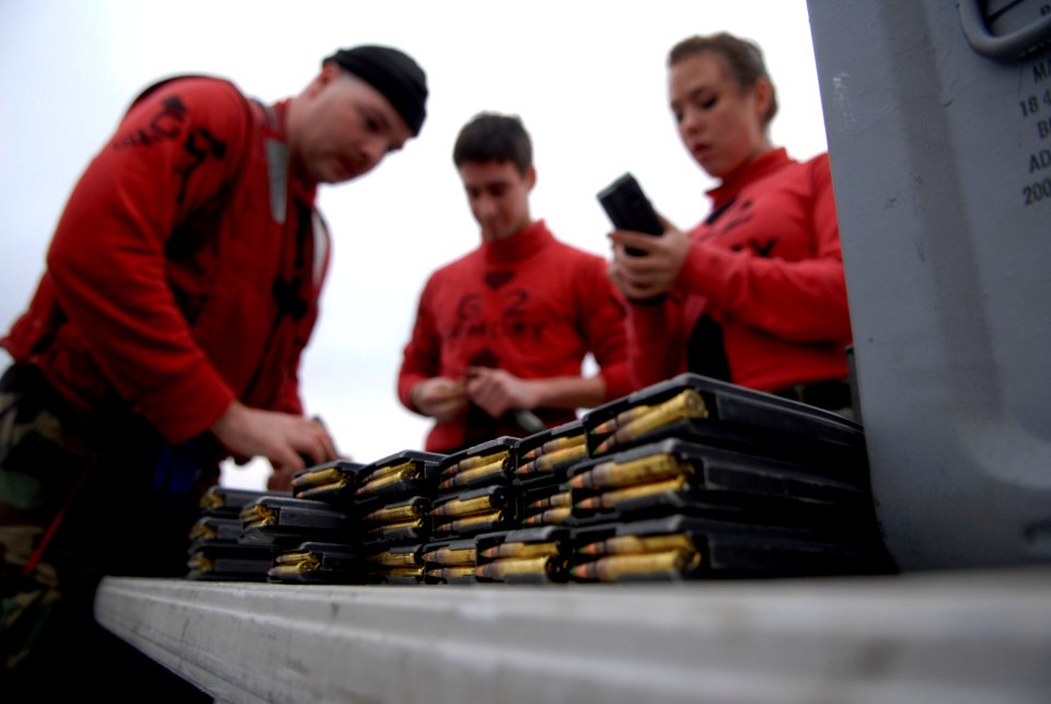 US Navy 100127-N-2475A-042 Sailors load magazine clips in preparation of an M-16 gun qualification shoot aboard the Nimitz-class aircraft carrier USS John C. Stennis (CVN 74)