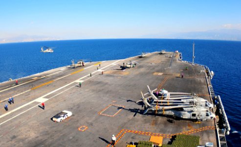 US Navy 100128-N-4774B-001 The Nimitz-class aircraft carrier USS Carl Vinson (CVN 70) conducts helicopter flight operations off the coast of Haiti