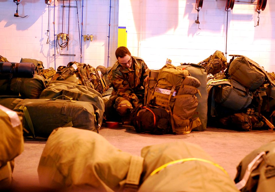 US Navy 100128-N-5787K-001 A Sailors conducts a final check on his equipment before deploying to Haiti to support Operation Unified Response