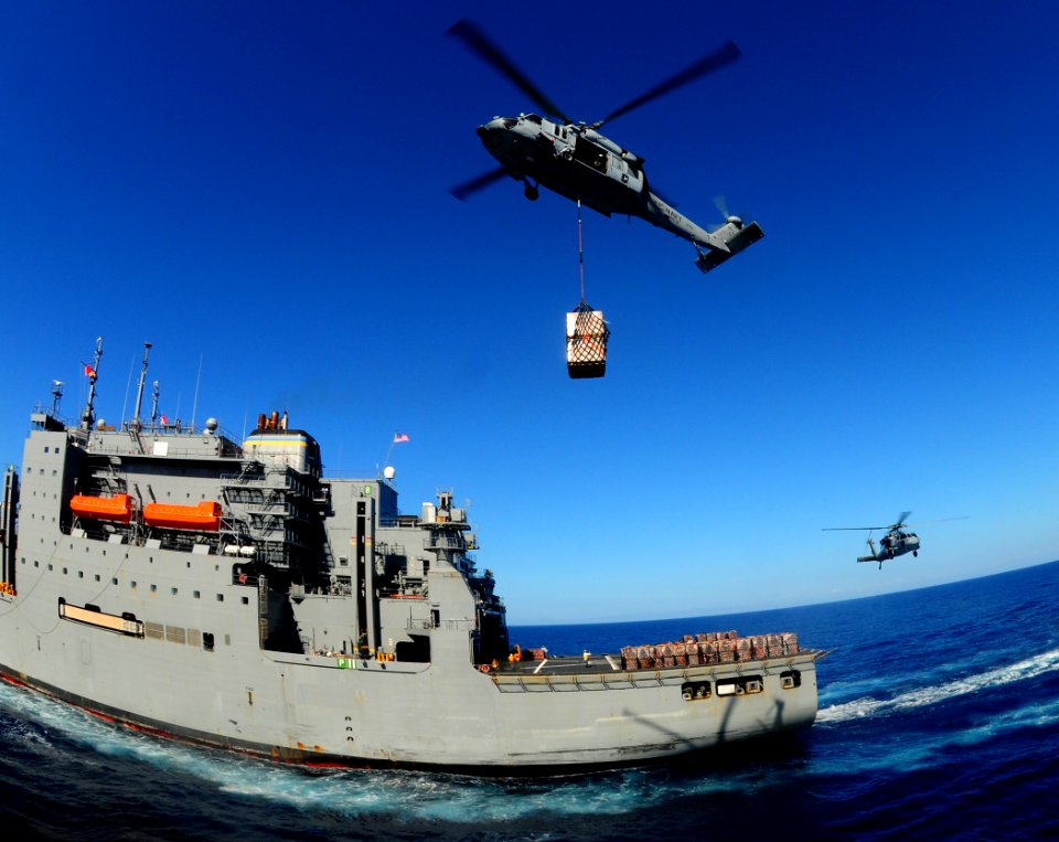 US Navy 100127-N-7508R-121 An MH-60S Sea Hawk helicopter from Helicopter Sea Combat Squadron (HSC) 22 prepares to carry supplies from the Military Sealift Command