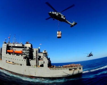 US Navy 100127-N-7508R-121 An MH-60S Sea Hawk helicopter from Helicopter Sea Combat Squadron (HSC) 22 prepares to carry supplies from the Military Sealift Command photo