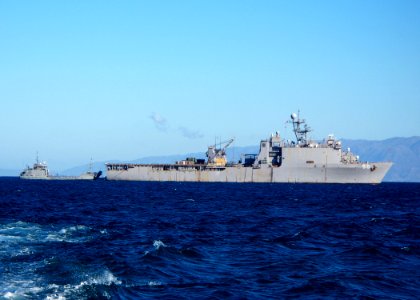 US Navy 100128-N-0924R-002 The amphibious dock landing ship USS Carter Hall (LSD 50) transfers humanitarian supplies and equipment to U.S. Army Landing Craft Unit (LCU) 2001