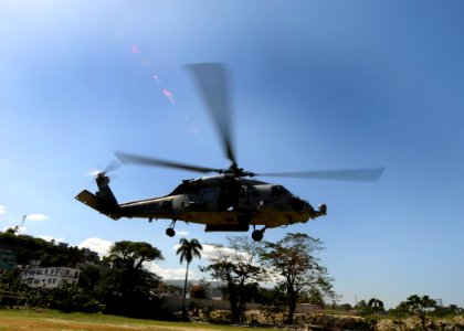 US Navy 100129-N-6676S-011 An HH-60H Sea Hawk helicopter takes off from the landing zone at the Killick Haitian Coast Guard Base to evacuate injured Haitian citizens to a treatment facility