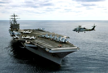 US Navy 100129-N-6003P-073 An SH-60F Sea Hawk helicopter assigned to the Dusty Dogs of Helicopter Anti-Submarine Squadron Seven (HS) 7 patrols the waterways around the Nimitz-class aircraft carrier USS Harry S. Truman (CVN 75)