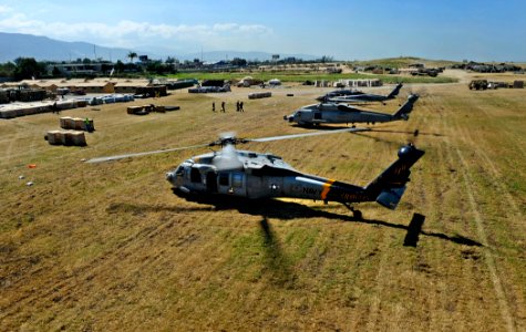 US Navy 100128-N-5345W-108 H-60 Sea Hawk helicopters from various U.S. Navy squadrons prepare in the landing zone area at Aerodome de Jacmel