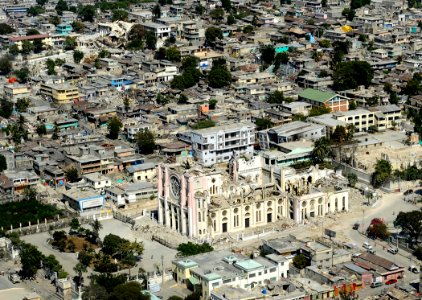 US Navy 100128-N-5345W-148 The Roman Catholic cathedral, in the foreground, and the Haiti capital of Port-au-Prince, are in ruins after the 7.0 magnitude earthquake that struck the region on Jan. 12, 2010