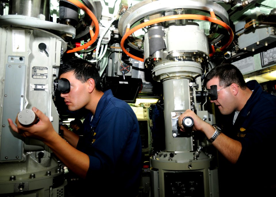 US Navy 100129-N-3560G-003 Officers can the horizon through periscopes aboard the attack submarine USS Santa Fe (SSN 763)