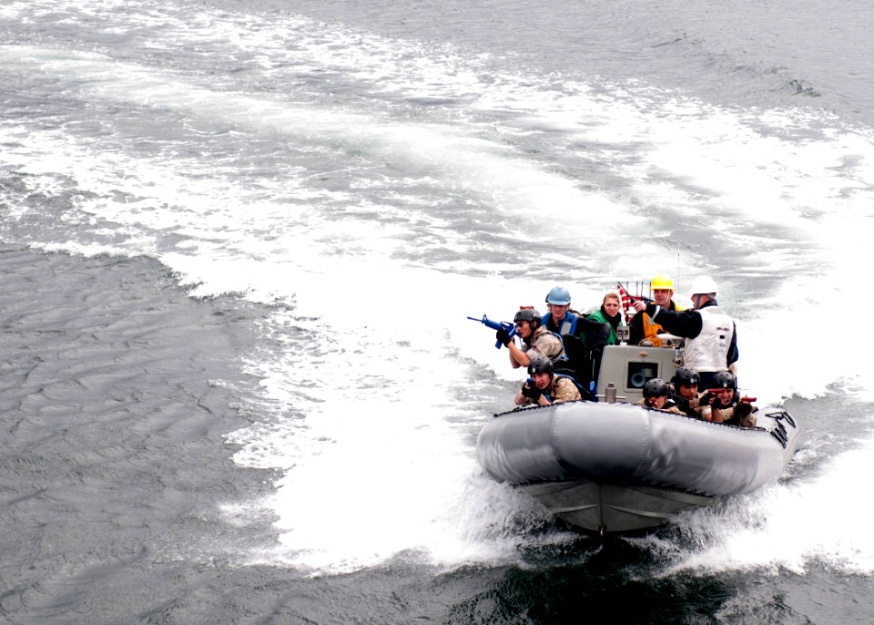 US Navy 100128-N-8721D-003 Sailors assigned to the visit, board, search and seizure (VBSS) team aboard the guided-missile destroyer USS Lassen (DDG 82), perform training during a VBSS exercise