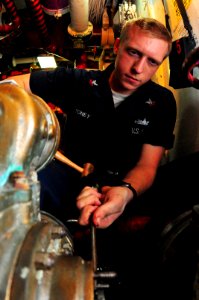 US Navy 100129-N-7939W-041 USS Nimitz sailor conducts AFFF maintenance