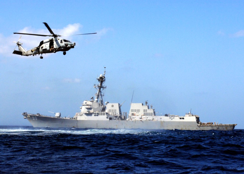 US Navy 100201-N-7088A-048 The Arleigh Burke-class guided-missile destroyer USS Farragut (DDG 99) and an SH-60B Sea Hawk helicopter assigned to Helicopter Anti-Submarine Squadron Light (HSL) 42, participate in a training evolut