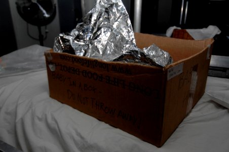 US Navy 100129-N-8936G-045 The box a newborn girl was found in Jan. 23 before being airlifted to the amphibious assault ship USS Nassau (LHA 4)
