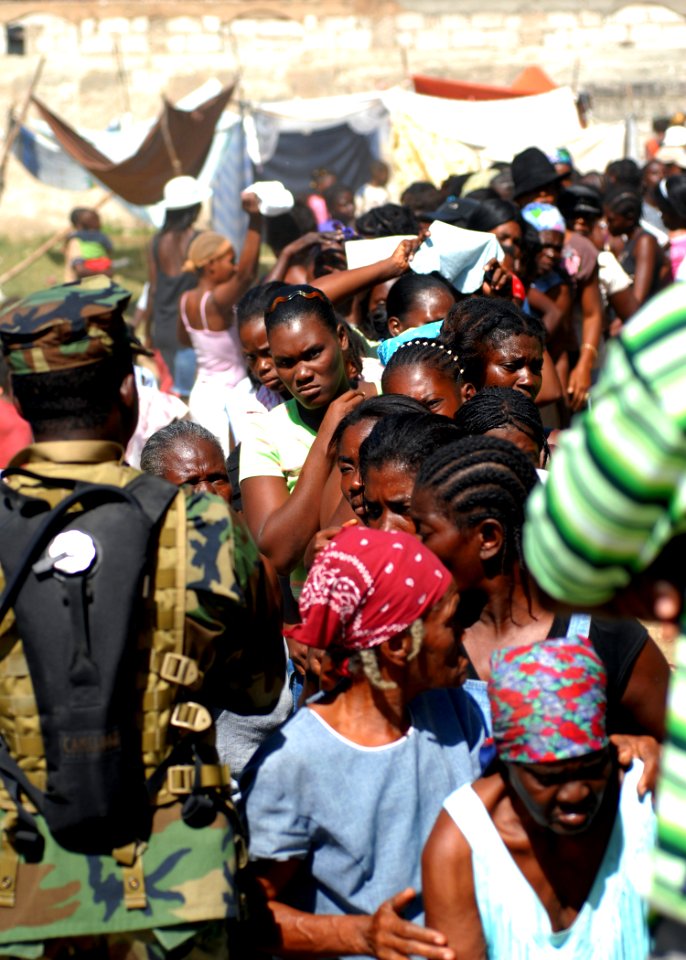 US Navy 100202-N-4971L-082 Haitian citizens line up for relief supplies