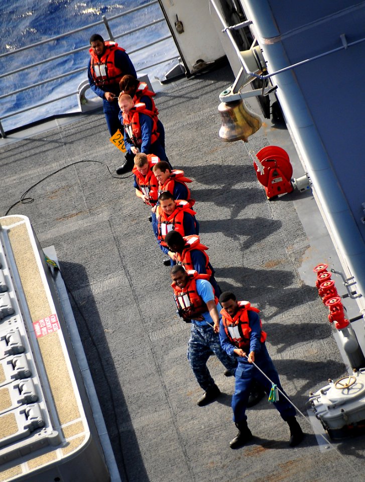 US Navy 100202-N-4774B-117 Sailors aboard the guided-missile cruiser USS Bunker Hill (CG 52) heave the phone and distance line during a refueling at sea with the Nimitz-class aircraft carrier USS Carl Vinson (CVN 70)