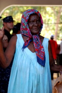 US Navy 100202-N-4971L-116 A Haitian woman receives reliefs supplies