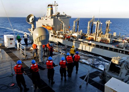 US Navy 100201-N-1082Z-018 Sailors, assigned to the amphibious dock landing ship USS Ashland (LSD 48) handle lines during a replenishment at sea with the Military Sealift Command fleet replenishment oiler USNS Big Horn (T-AO 19