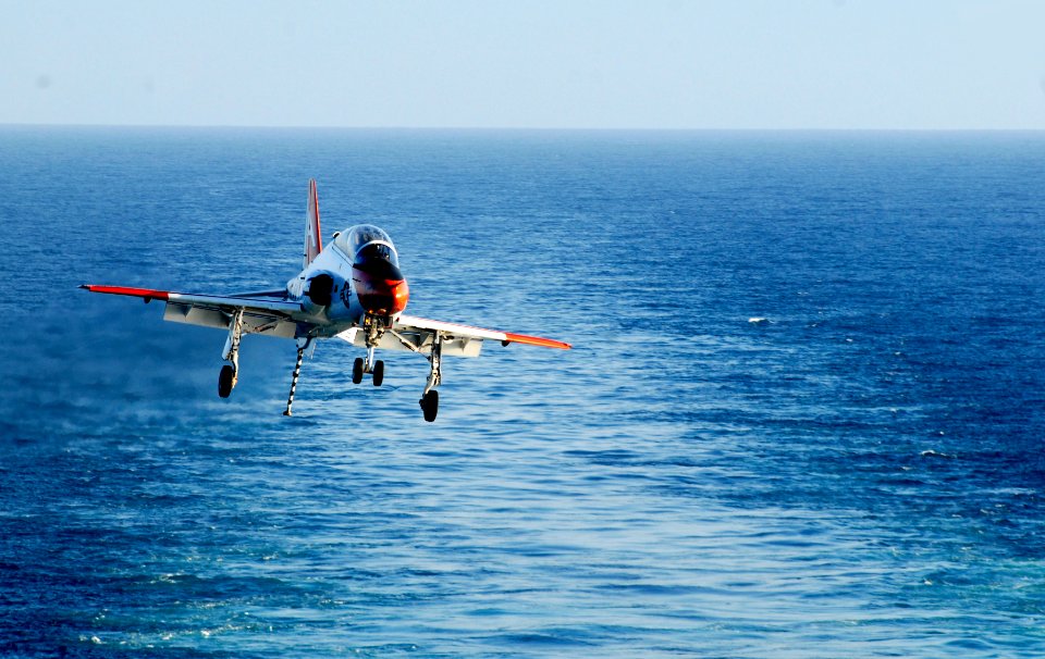 US Navy 100203-N-2475A-391 A T-45C Goshawk training aircraft assigned to Training Air Wing (TRAWING) 1 prepares to land aboard the Nimitz-class aircraft carrier USS John C. Stennis (CVN 74)