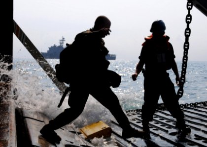US Navy 100201-N-5538K-230 Marine prepares to board a landing craft utility