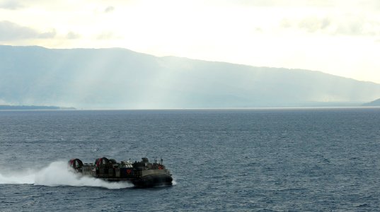 US Navy 100201-N-1831S-091 landing craft air cushion (LCAC), assigned to Assault Craft Unit (ACU) 4, transits near Baie De Grand Goave, Haiti as it returns to the amphibious assault ship USS Bataan (LHD 5)