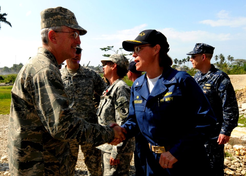 US Navy 100203-N-6676S-004 Capt. Cindy Thebaud, commander of Africa Partnership Station West, embarked aboard the amphibious dock landing ship USS Gunston Hall (LSD 44), welcomes Air Force Gen. Douglas Fraser