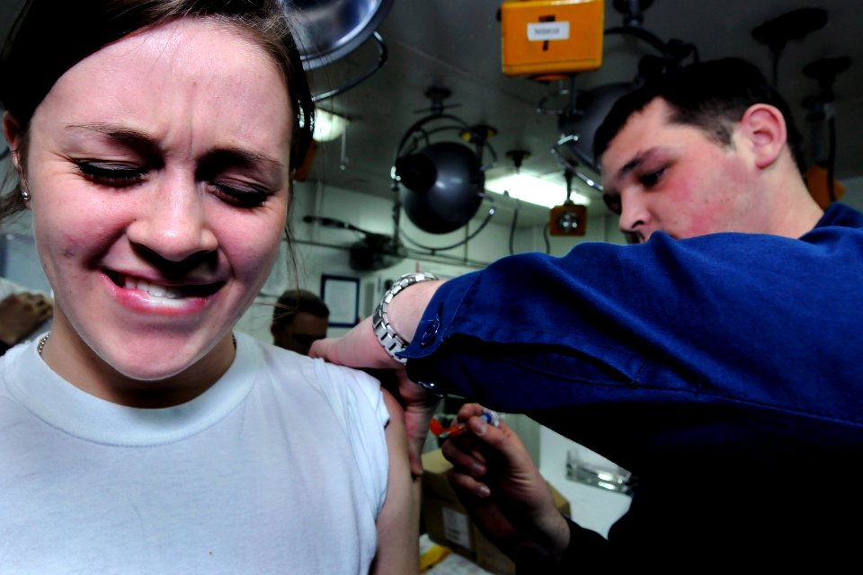 US Navy 100202-N-5716H-034 Sailor receives a vaccination abouard USS Blue Ridge
