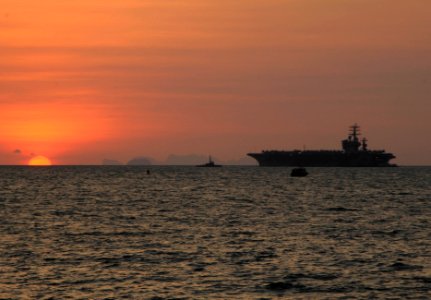 US Navy 100202-N-3038W-056 he aircraft carrier USS Nimitz (CVN 68) is at anchorage at sunrise during a port visit to Phuket, Thialand