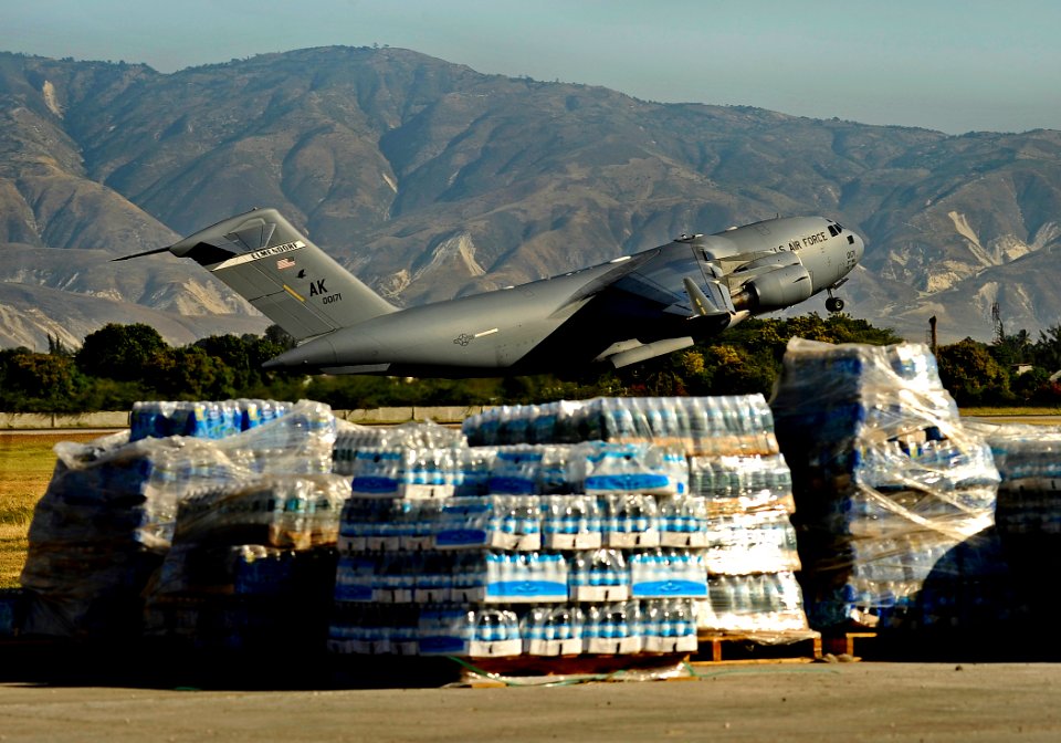 US Navy 100202-N-5345W-021 A U.S. Air Force C-17 Globemaster transport aircraft lifts off from the runway at Aerodome de Jacmel in Port-au-Prince, Haiti, after delivering humanitarian supplies