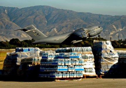 US Navy 100202-N-5345W-021 A U.S. Air Force C-17 Globemaster transport aircraft lifts off from the runway at Aerodome de Jacmel in Port-au-Prince, Haiti, after delivering humanitarian supplies